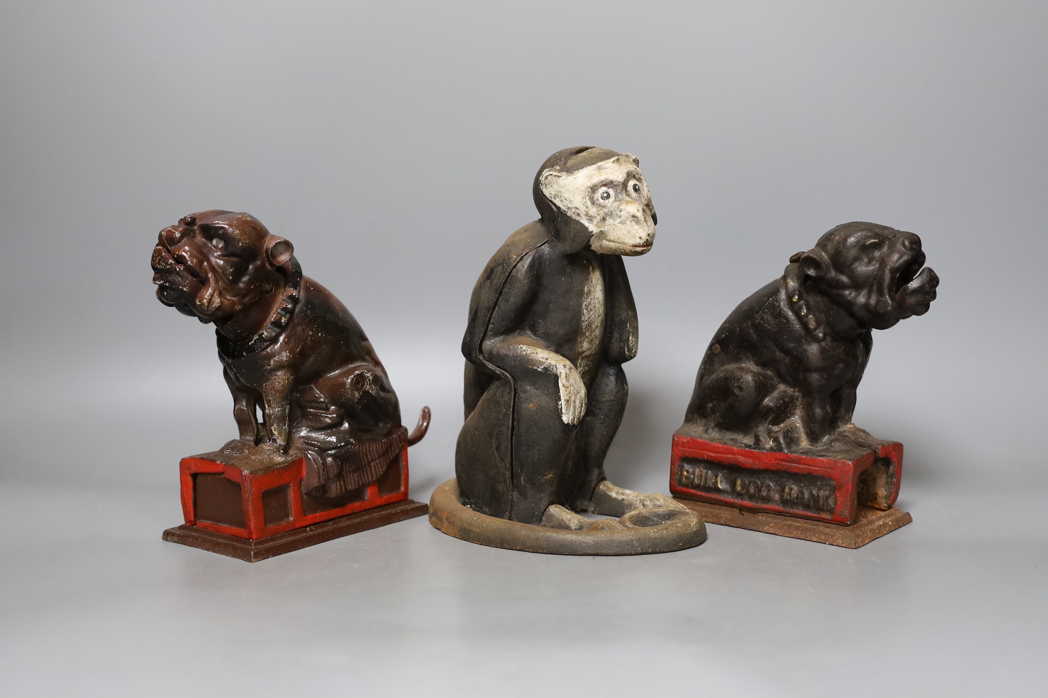 Two cast iron Bull Dog Banks, 16cm, and a cast iron monkey bank